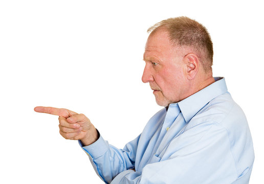 Serious blame, senior man pointing finger at someone