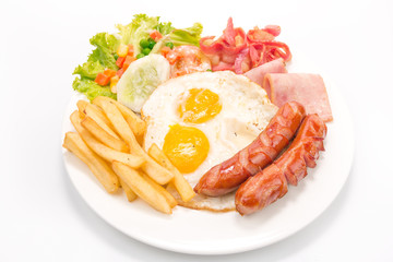 American  breakfast with fried eggs, bacon, sausages, toasts and