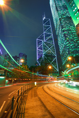 Fototapeta na wymiar Road light trails on streetscape buildings backgrounds in HongKo