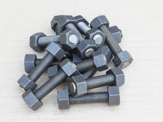 Industrial stud bolts on paper recycle background