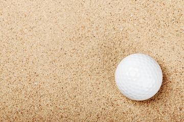golf ball on the sand