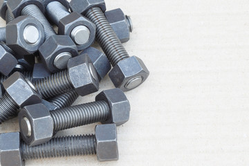 Industrial stud bolts on paper recycle background