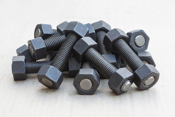 Industrial stud bolts on paper recycle background