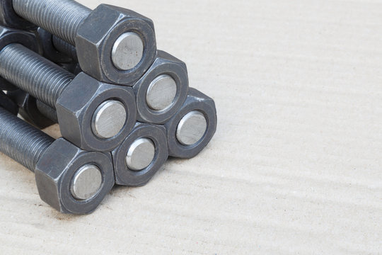 Industrial stud bolts on paper recycle background