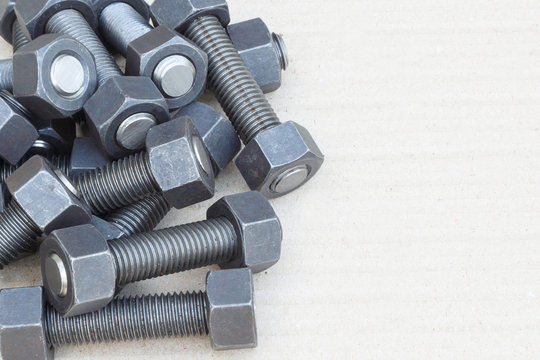 Industrial stud bolts on paper recycle background