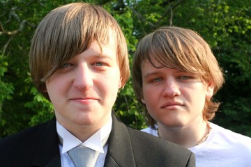Teen Brothers In Tux And T-Shirt