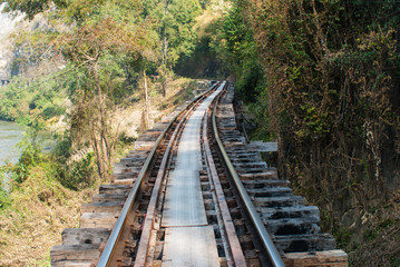 Obraz premium Old railway tracks along River Kwai, Kanjanaburi province, Thail