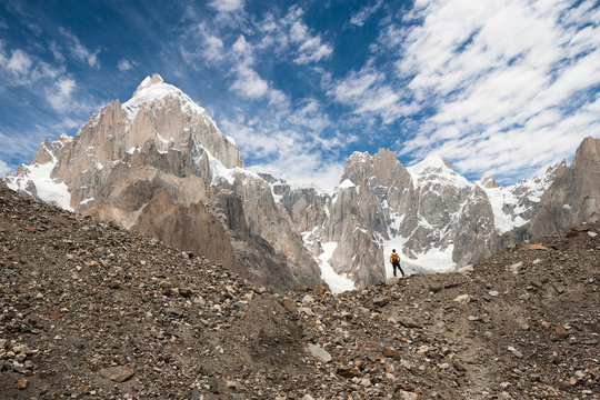 Trekker with Karakoram mountain range, Northern Pakistan