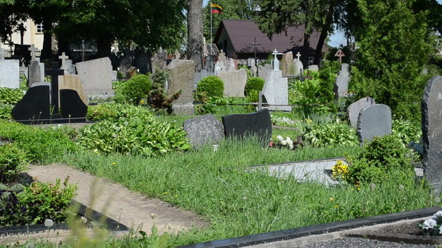 rural cemetery graves tomb stones panorama and old woman