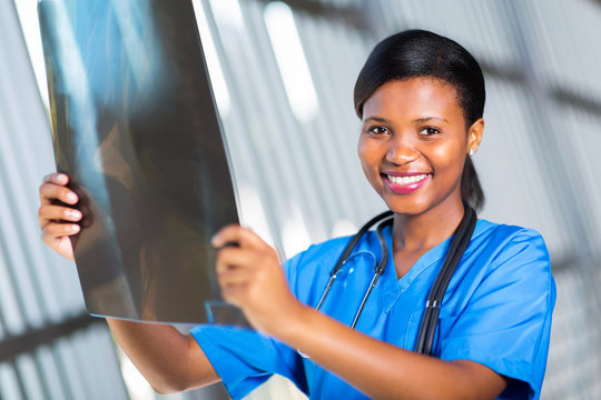 african american healthcare worker with x-ray - Powered by Adobe