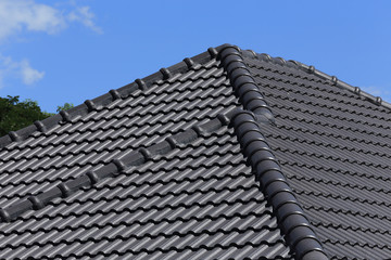black tiles roof on a new house