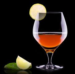 Cognac or brandy on a black