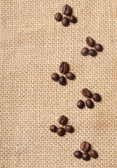 trace of coffee beans on burlap background
