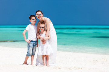 Mother and kids on a tropical beach