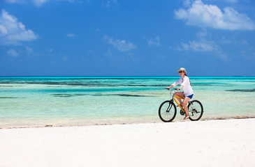Fototapeta premium Young woman biking