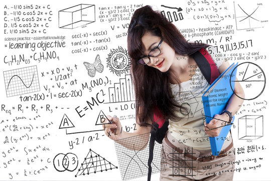 Young Student Writing On Whiteboard