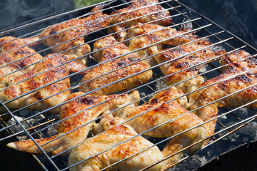 Grilling chicken on a barbecue