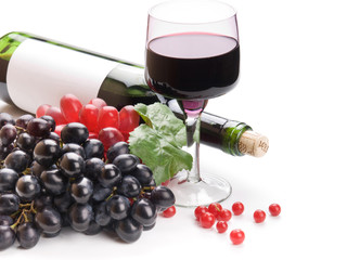 Glass of black wine and grapes on white background