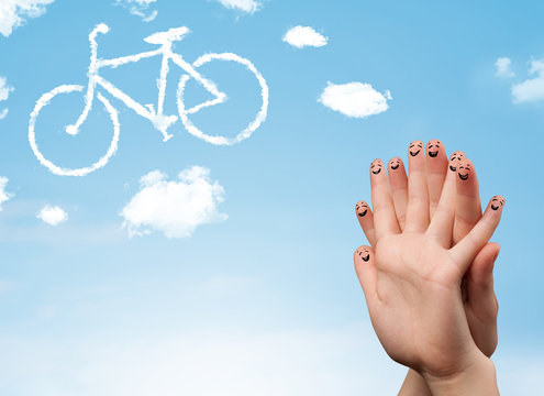 Happy smiley fingers looking at a bicycle shapeed cloud