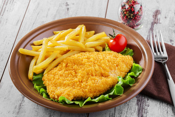breaded chicken schnitzel fries