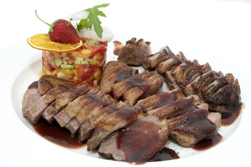 steak sauce and greens on a white background