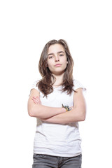 Fototapeta premium strict looking female teenager with crossed arms, isolated on wh