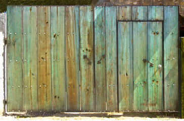 Old green wooden gate