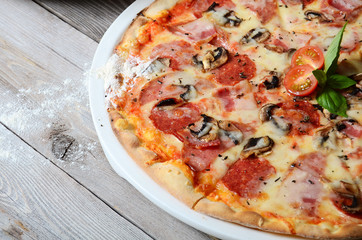 The Italian pizza with olives and a salami