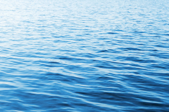Blue water photo background with soft waves