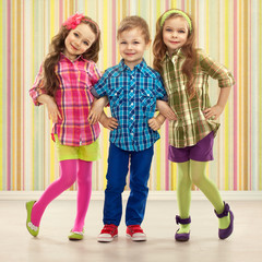 Fototapeta premium Cute fashion kids are standing together