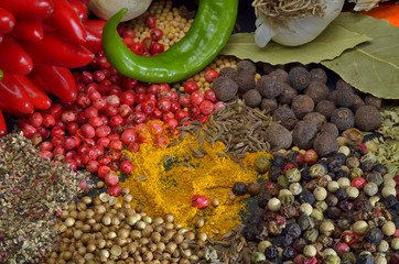 Green and red hot chili peppers and spice