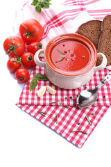 Tasty tomato soup and vegetables, isolated on white