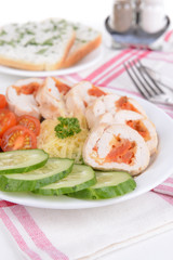Delicious chicken roll on plate on table close-up
