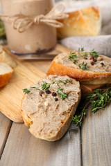 Fresh pate with bread on wooden table