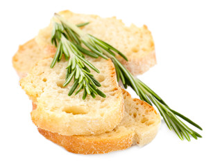 Fresh bread and rosemary isolated on white