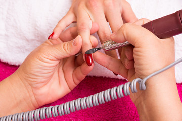 Woman receiving manicure in a  Spa,   