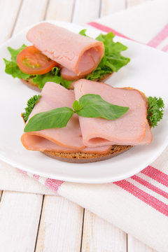 Delicious sandwiches with lettuce and ham