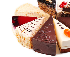 Assortment of pieces of cake, isolated on white © Africa Studio