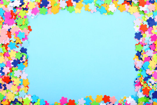 Confetti frame on blue background