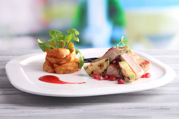 Grilled meat  with fried potato and marrow pieces and