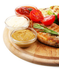 Grilled steak with spices, herbs and vegetables