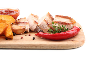 Grilled steak with fried potato pieces and grilled vegetables