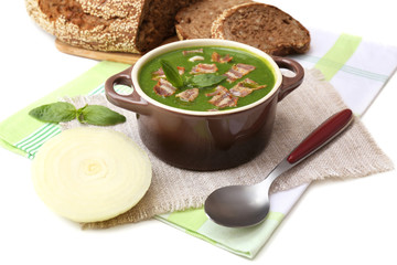 Tasty soup in saucepan, isolated on white