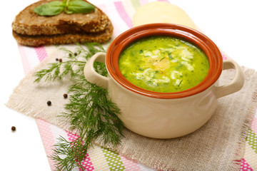 Tasty soup in saucepan, isolated on white