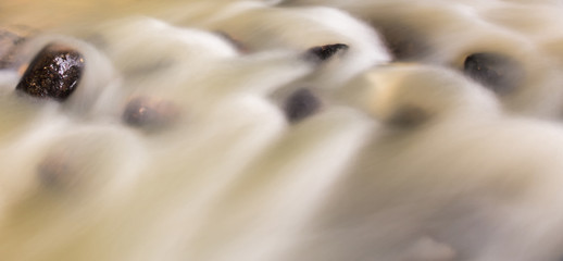 Water and rock  in the river natural motion blur abstract