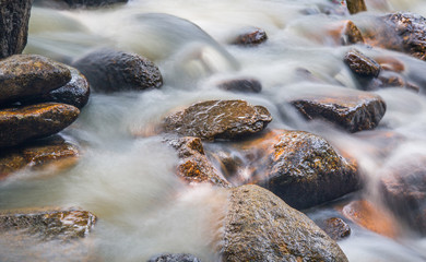 Water and rock  in the river natural motion blur abstract