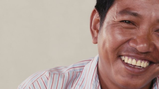 Portrait of Asian man looking at camera, people emotions