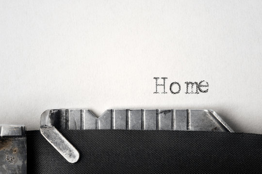 "Home" written on an old typewriter