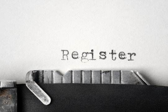 "Register" written on an old typewriter