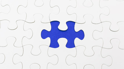 Missing puzzel in blue color. Selective focus